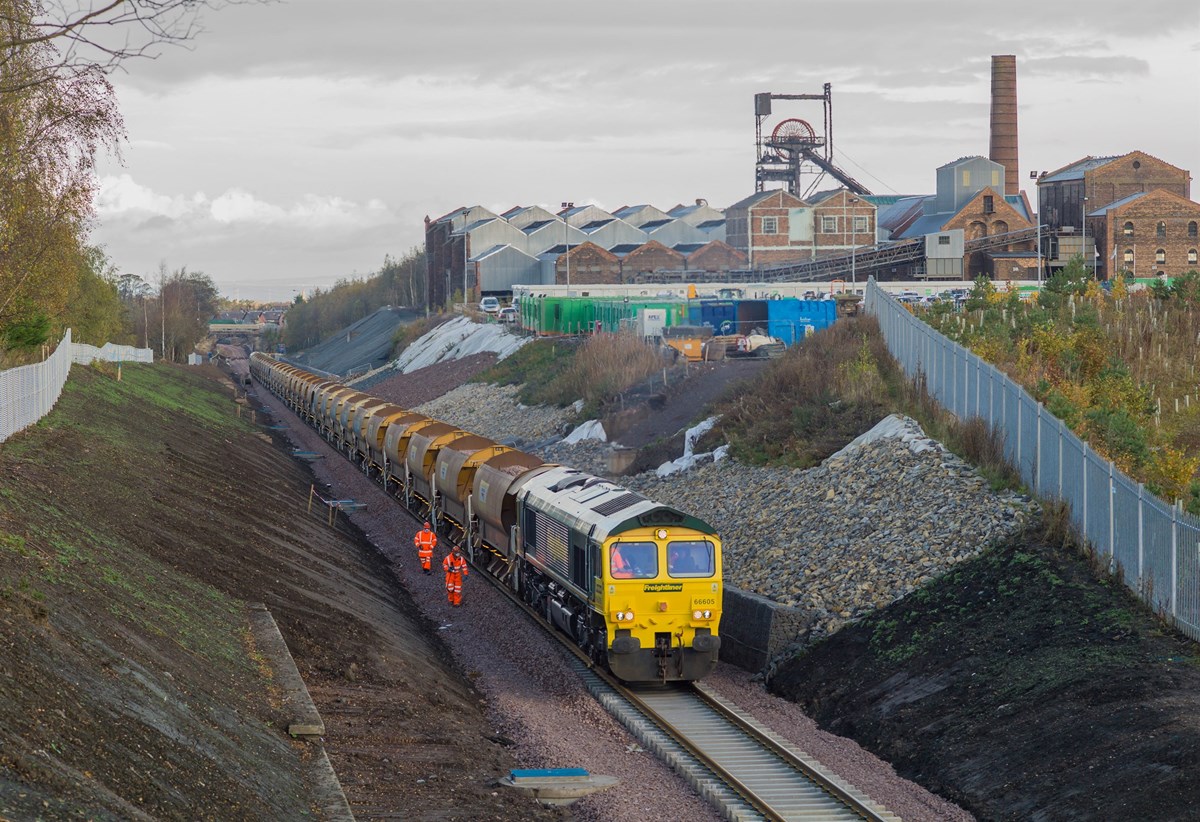 Freightliner Heavy Haul 66605, with FLHH 66602 tailing, powers the ballast train at Lady Victoria Pit (Scottish Mining Museum), Newtongrange, laying ballast upon the Up line on October 24.