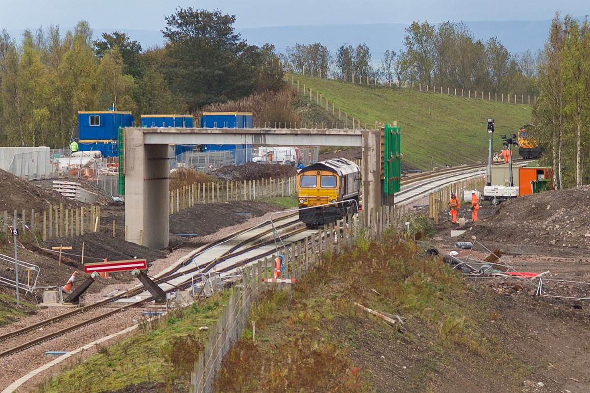 When track laying operations started on the Borders Railway, as well as GB Railfreight 66736 Wolverhampton Wanderers on the tracklaying train, GBRf 66726 Sheffield Wednesday was also in attendance at Millerhill, awaiting the return of the train. Seen at Millerhill, 66726 is stands in the foreground, whilst 66736 disappears around the bend towards Shawfair on the down line on October 6.