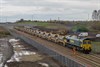 With Freightliner Heavy Haul 66602 at the head (with FLHH 66605 bringing up the rear), the first 3,000 tonne ballast train enters the Borders Railway at Newcraighall. The entrance to Millerhill Yard can just be seen to the left on October 13.