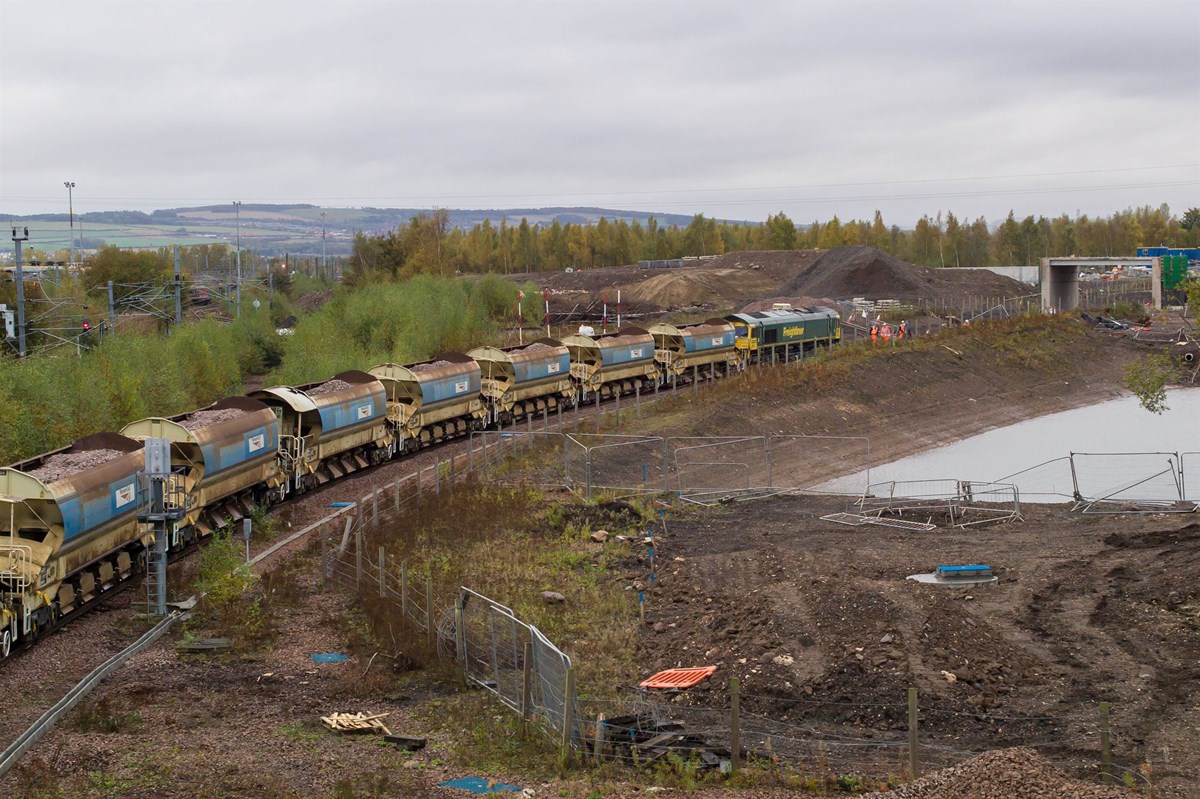 Freightliner Heavy Haul 66602 (with FLHH 66605 bringing up the rear) hauls the 3,000 tonne ballast train as it deposits its load approaching Shawfair station on October 13.