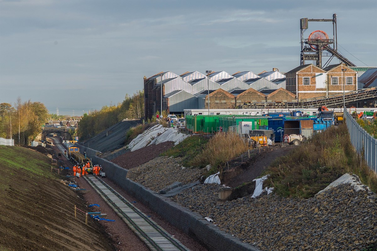 GB Railfreight 66736 Wolverhampton Wanderers propels the BAM track laying train past Lady Victoria Colliery (Scottish Mining Museum) at Newtongrange on October 18.