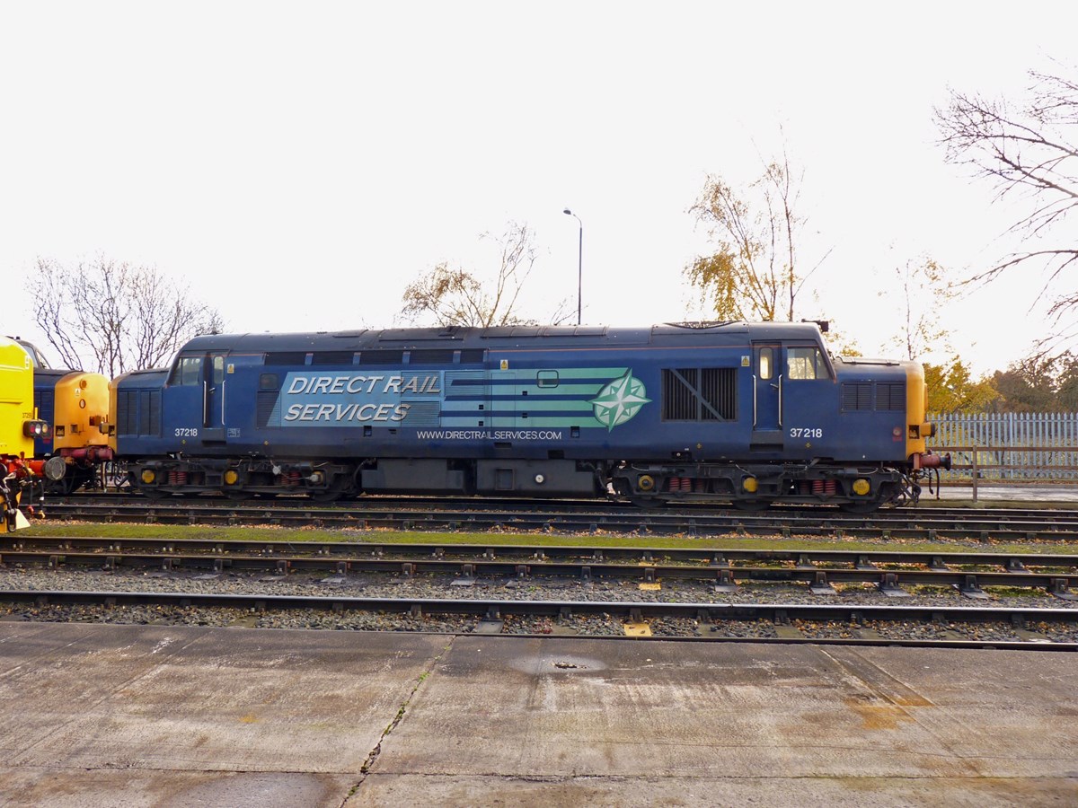A side view of Direct Rail Services 37218, while it waits its next duty at Crewe Gresty Bridge. The ‘37/0’ is one of many locomotives withdrawn by EWS, but which was subsequently acquired for re-use by DRS.