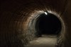 The eerie, mysterious passageway at Aldywch, leading from the crossroads of walkways behind the platforms back to the lifts. The wall lining was never completed because it was not used by the public, owing to low passenger numbers.