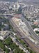 Westbourne Park is perhaps currently best known as a major Crossrail construction site - the first of two tunnel boring machines began work at the Royal Oak portal in March 2012. The area is also dominated by the A40 Westway flyover and the red brick bus depot. A GBRf Class 66 waits in the sidings with a Crossrail spoil train (the contents of which will end up on Wallasea Island in Essex), while First Great Western HSTs and DMUs pass on the Great Western Main Line.