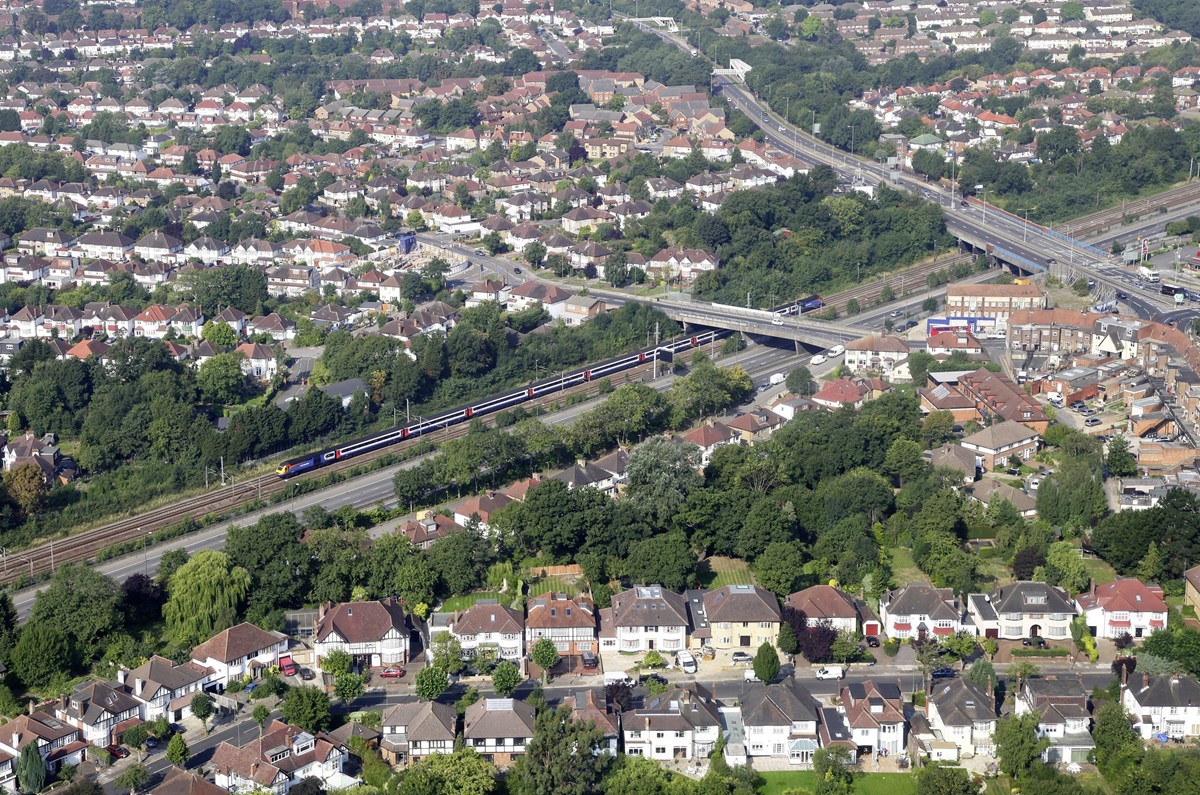 An East Midlands Trains HST speeds along the Midland Main Line through Mill Hill Broadway on September 4 2013, among the ubiquitous 1930s suburban development that typifies so much of North London.