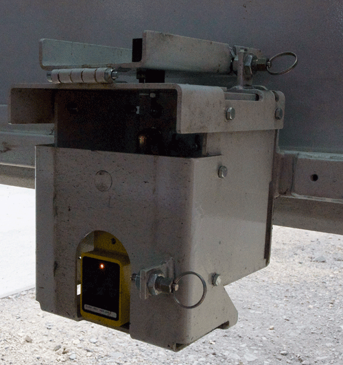 Light beams protect gangs working in the MMT by halting the machine if people or tools break them. The MMT can work in creep mode, moving slowly along a track as the gang works. PHIL HAIGH