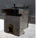Light beams protect gangs working in the MMT by halting the machine if people or tools break them. The MMT can work in creep mode, moving slowly along a track as the gang works. PHIL HAIGH