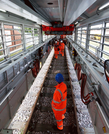 The mobile maintenance car provides light and shelter for track gangs. Pneumatic slats provide ventilation, and the walls include an emergency safety cord as well as power points. PHIL HAIGH