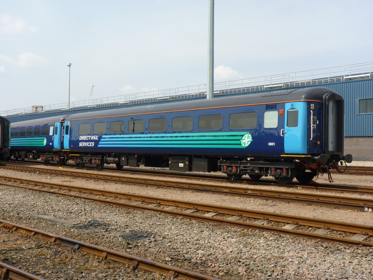 Direct Rail Services has a rake of Mk 2 carriages hired to Greater Anglia. One of these, Mk 2f Open Standard (TSO) 6001 waits its next duty.
