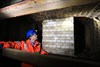 NR Project Manager Greg Thornett looks at the remains of Southwark Park station, hidden in the catacombs under the railway in Bermondsey. NETWORK RAIL.