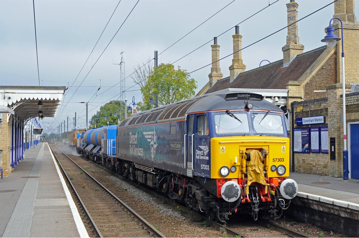 Direct Rail Services 57303 Pride of Carlisle leads an RHTT through Downham Market on October 15. On the rear is DRS 57306, albeit still in Network Rail livery. JOHN RUDD.