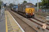 Locomotives used on RHTTs quickly become dirty with all the spray thrown up onto their cabs from the water jets. On October 20, only five days after it was photographed sparkling at Downham Market, Direct Rail Services 57303 Pride of Carlisle is in need of a wash as it powers a Stowmarket-Southend Victoria RHTT through Wickford. CHARLIE ROBBIBNS.