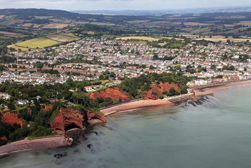 A First Great Western High Speed Train runs between Kennaway Tunnel, the first of five between Dawlish and Teignmouth, and Coryton Tunnel. The latter is the furthest accessible point using the sea wall footpath from Dawlish. First Great Western train at Kennaway Tunnel