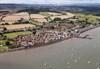 A First Great Western High Speed Train races west through Starcross. A pumping station from Brunel's atmospheric railway remains, standing next to the two-platform station used by FGW. First Great Western train races through Starcross