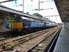 On August 9 2014, Direct Rail Services 47853 Rail Express waits to trail the 1310 to Great Yarmouth, which was hauled by DRS 47501 Craftsman. The 'short set' as it is known by locals, was used as the usual rakes of Mk 3s that are used on through trains to and from London to the coast were not available.