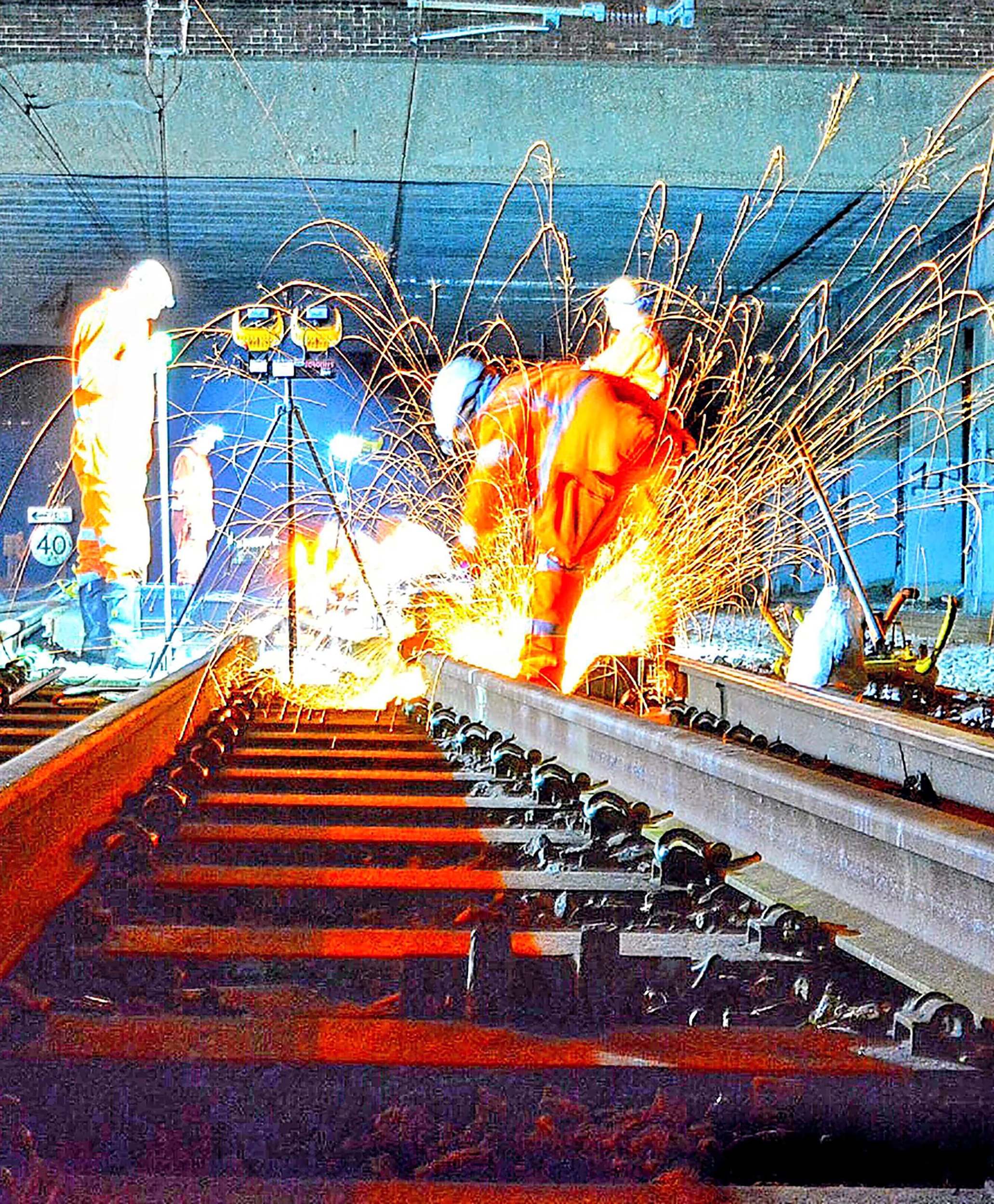 Workers’ repairing a railway line. NETWORK RAIL.