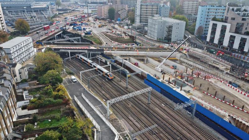 Euston’s approach, looking in the ‘Up’ direction towards the station (top left). The red double-decker bus is travelling south on Hampstead Road, while the bridge above the orange-fronted Class 710 and the green Pendolino carries Granby Terrace over the West Coast Main Line. Granby Terrace is being extended (right) to also traverse the future HS2 lines. CHRIS HOWE