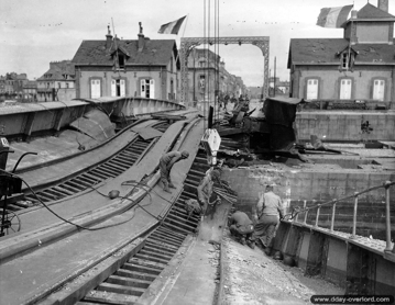 American sappers from the 333rd Engineer Special Service Regiment remove the swing bridge sabotaged by the Germans in Cherbourg.