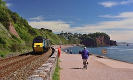 Exposed to the elements: a Great Western Railway HST passes Sprey Point at Teignmouth, after leaving Parsons Tunnel, on June 4 2021. This stretch of line is at the mercy of cliff falls on one side and high seas on the other. ALAMY.