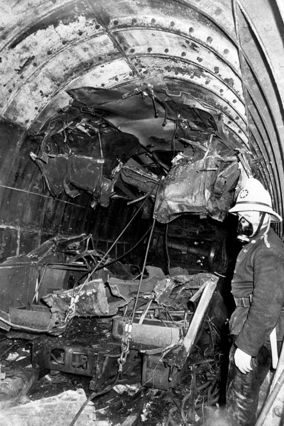 Some idea of the horror and force of the accident can be gleaned by the grab handles still attached to the roof of the 1938 Stock - but now suspended from the tunnel roof. Having ridden up in the impact, the lead vehicle has been destroyed. ALAMY.