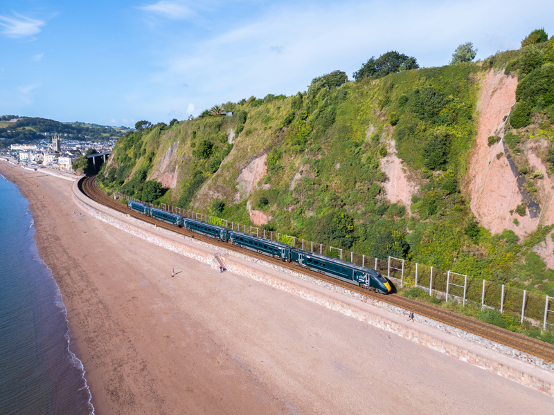 GWR 800016 departs Teignmouth working the 0640 Penzance to Cardiff Central on August 29 2024. The currently unfunded Phase 5 aims to prevent landslips that could cause prolonged closures along this one-mile stretch between Teignmouth and Parsons Tunnel. STEVE DONALD.