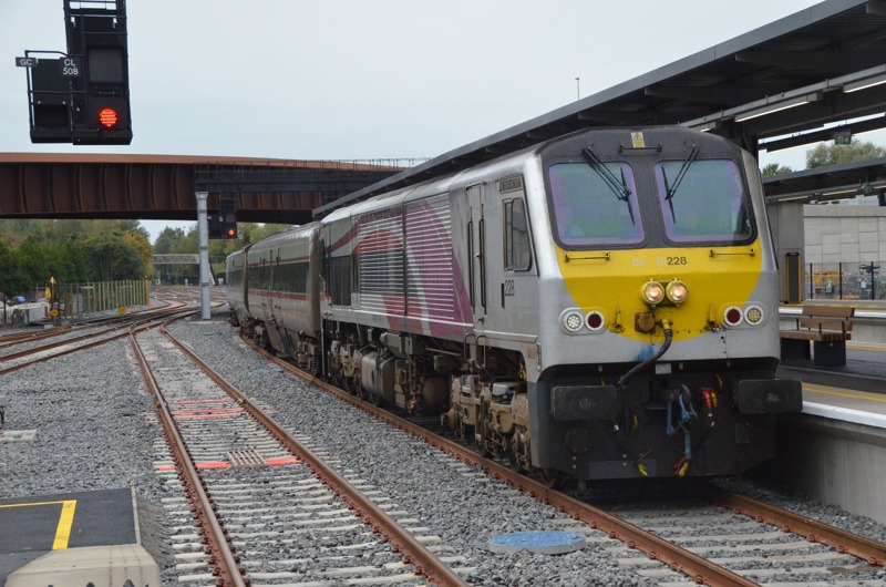 Northern Ireland Railway's Class 201 loco No. 228 arrives at Belfast Grand Central with the 0850 from Dublin on the first day of operations at the station