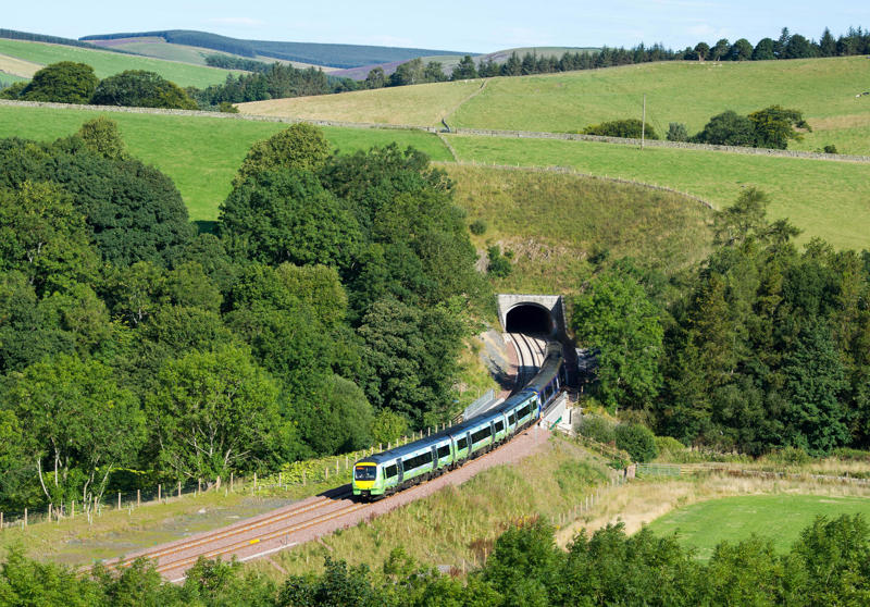 Scottish Borders UK, New Borders Railway. A train from Edinburgh exits Bowshank tunnel near Galashiels. ALAMY 2015