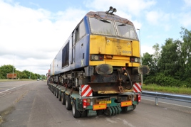 Land Recovery bought a dozen Class 60s from DB Cargo in January. They are now being collected from Toton and taken to a storage site near Alsager. On June 23, the Reid Freight low loader, carrying 60078, was parked in a lay-by near Uttoxeter, prior to the final leg of its journey to Cheshire. PIP DUNN.