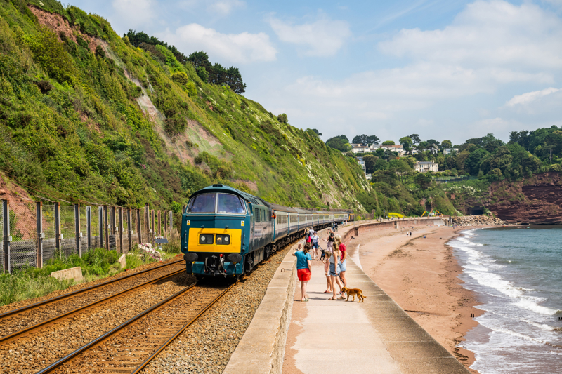 D1015 Western Champion skirts along the sea wall at Teignmouth with a Pathfinder Railtours excursion from Tame Bridge Parkway to Paignton for the English Riviera Airshow. JACK BOSKETT.