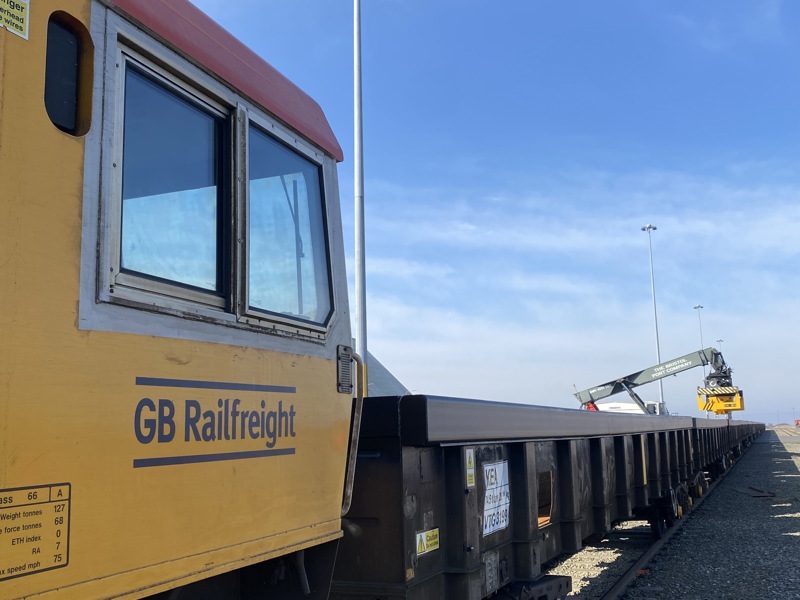 Steel slab being loaded onto train hauled by GBRf's 66783 at the Port of Bristol. GB RAILFREIGHT.