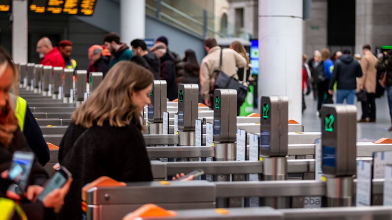 Passenger going through the ticket gatelines