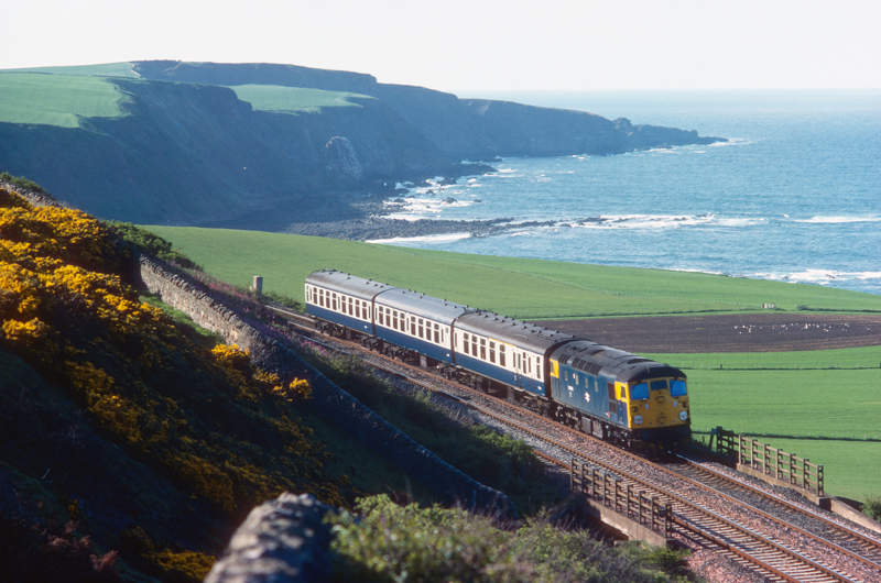 Les Nixon loved photographing all aspects of the rail scene, and had a real passion for Scotland. One of his most enjoyable pictures was this shot of 26029 skirting the sea at Burnmouth as it worked the last few miles of the 1710 Edinburgh- Berwick-upon-Tweed on May 30 1977. LES NIXON.