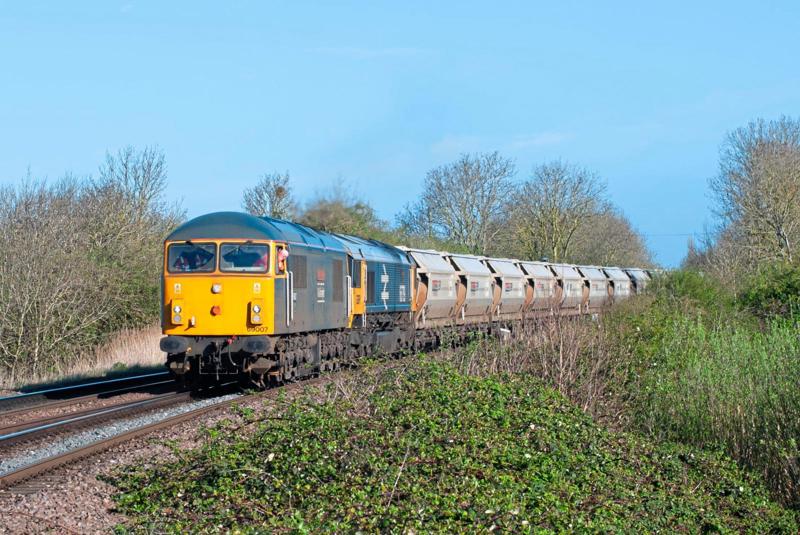 GB Railfreight 69007 passes Silt Drove (March) with the 0816 March Yard-Middleton Towers sand train on March 27. This was the first day GBRf entrusted a Class 69 with this work, hence having 66789 tucked inside as insurance. Network Rail has targets to grow freight use and is continuing to apply dispensations to allow heavy axle load traffic to run.