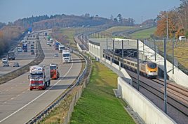 A5WBKF Eurostar train operating on the High Speed One (Channel Tunnel Rail Link) in a busy traffic corridor in Southern England. ALAMY