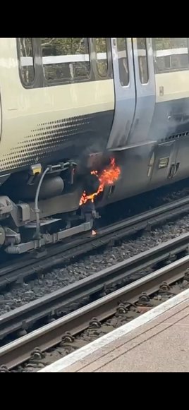 The burning axle on Networker unit 466037 at Bearsted station. Photo by Marcus Gallaway