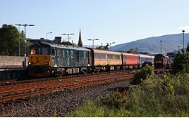 Caledonian Sleeper 73966 waits at Fort William on May 31, with the 1950 to London Euston. This is one of six Class 73/9s hired to CS by GB Railfreight, and was rebuilt from preserved 73005. The latter is interested in rebuilding more of its ‘73s’ with new engines, but requires the sufficient work. On the right is West Coast Railways 37518. PHIL METCALFE.  