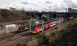 Virgin Trains East Coast 43239 climbs under the North London Line at Belle Isle, north London, on March 30, with the 1606 King’s Cross-Leeds, passing Grand Central 43465 trailing the 1228 Sunderland-King’s Cross. GC is one of two open access operators on the East Coast Main Line.  ANTONY GUPPY.