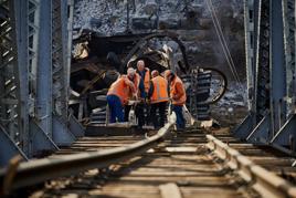 Attacks on Ukrzaliznytsia have meant that railway workers have had to learn to rapidly repair bridges and other key infrastructure under difficult circumstances. DOVGAN TETIANA.