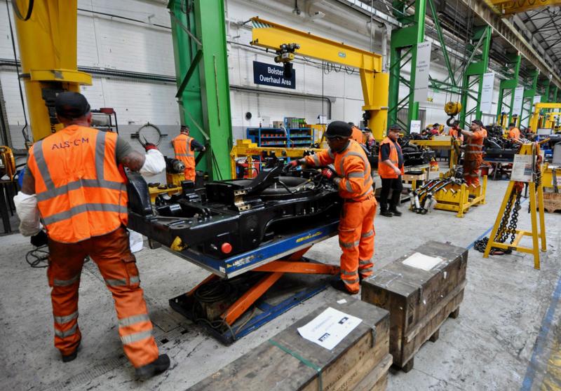 Alstom staff overhaul a bolster which sits inverted on a lifting table. PHILIP HAIGH