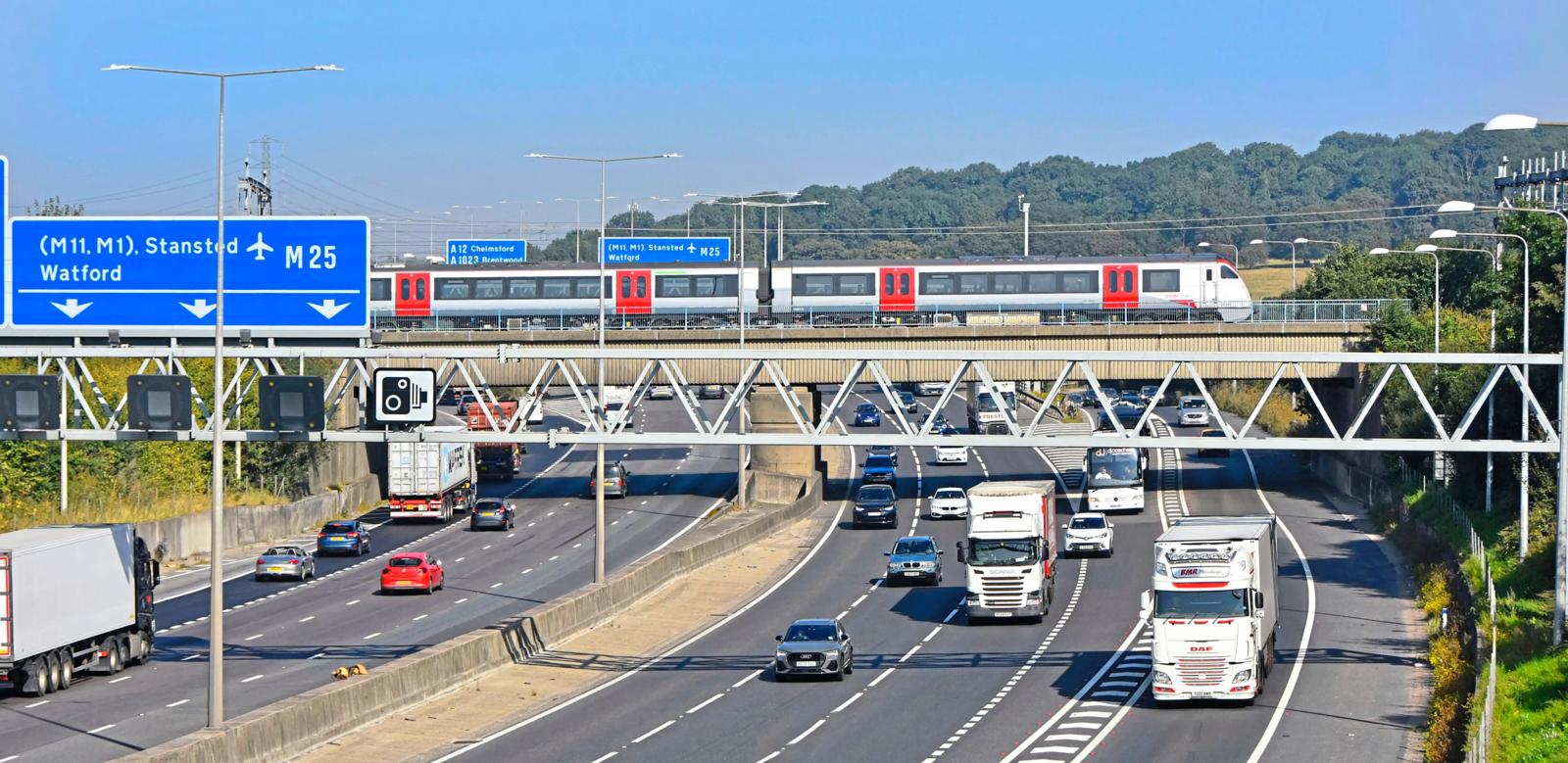 A Greater Anglia passenger train crosses over the M25 at Brentwood.