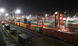 Containers being loaded onto trains in sidings