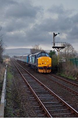 Direct Rail Services 37425 Sir Robert McAlpine/Concrete Bob passes Foxfield on the Cumbrian Coast on March 25, with the 0546 Barrow-in-Furness-Carlisle. ROBERT FRANCE.