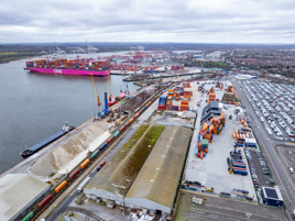 Solent Rail Terminal, with the DP World container port in the background.  Behind the rail terminal is a former dry dock built for the liner Queen Mary, with the Freightliner terminal in the far distance. Courtesy Solent Stevedores