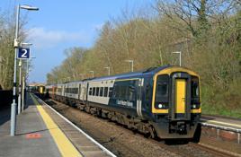 South Western Railway 159009 and 158885 arrive at Overton on April 18 with the 0640 Exeter St Davids-Basingstoke. The operator is exploring options for sections of third-rail electrification along the route. PAUL BIGGS.