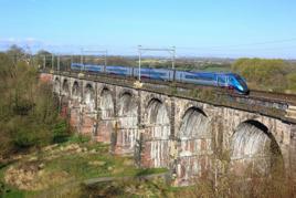 TransPennine Express 802203 crosses Sankey Viaduct with the 0824 Liverpool Lime Street-Newcastle on April 9 2023. TPE is one of the operators currently under the control of the DfT’s Operator of Last Resort - so effectively under public ownership. JAMIE SQUIBBS.